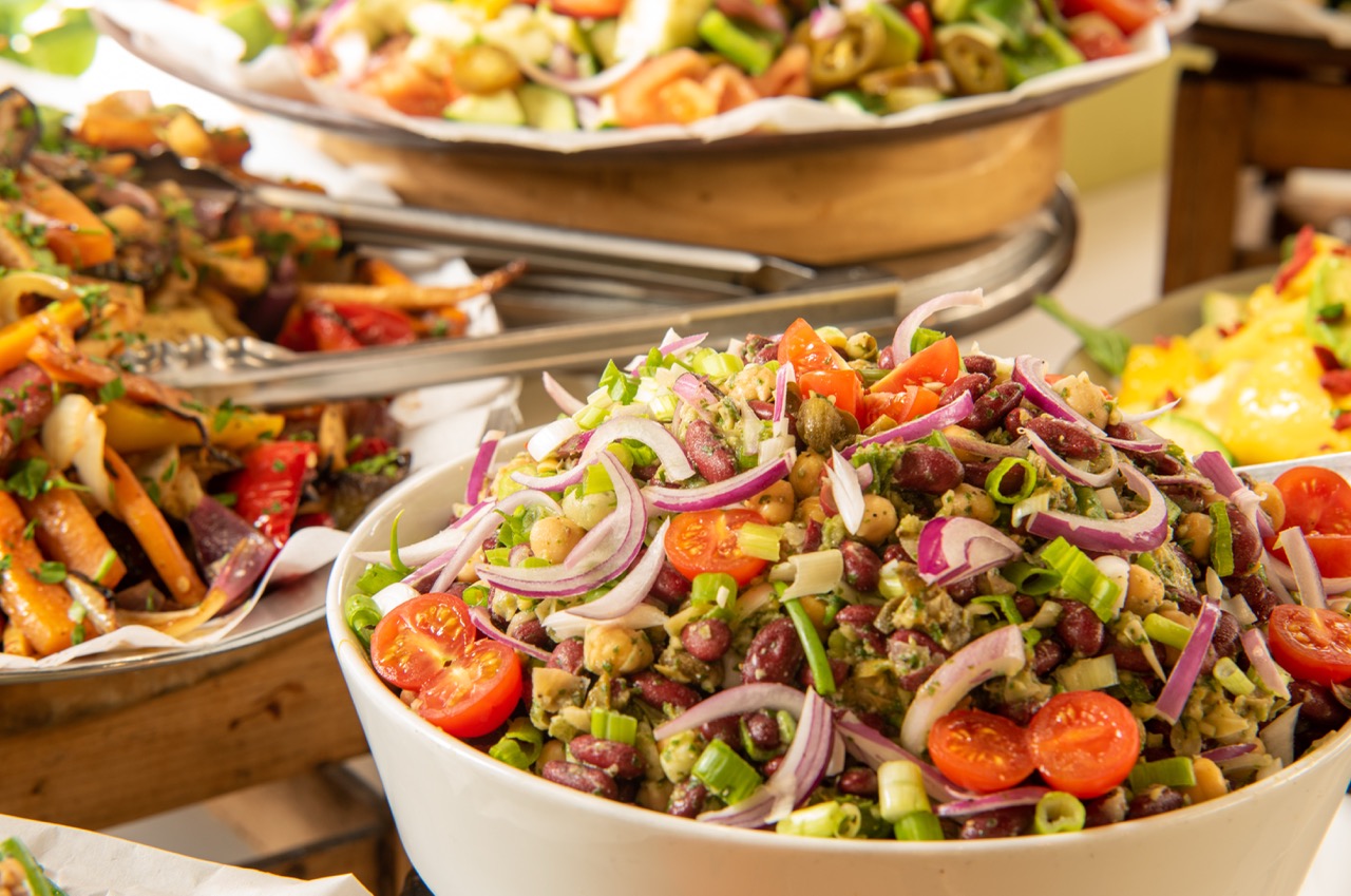 Buffet spread with multiple fresh salads