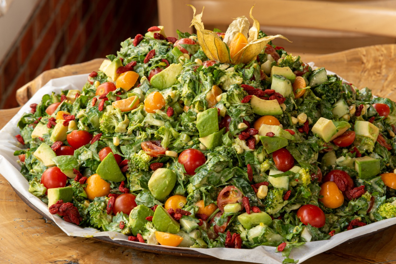 Colorful mixed salad with avocado and goji berries